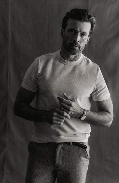 fit model sitting wearing The Organic Cotton Shop Tee in Oat Twist