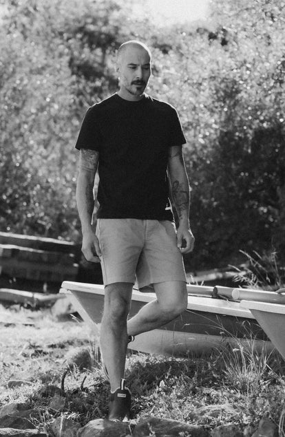 fit model walking wearing The Organic Cotton Shop Tee in Navy Twist
