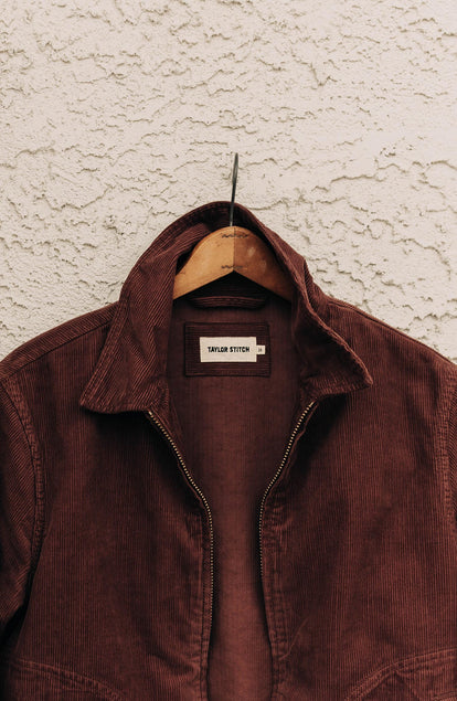 editorial image of The Piston Jacket in Dried Cherry Corduroy hanging