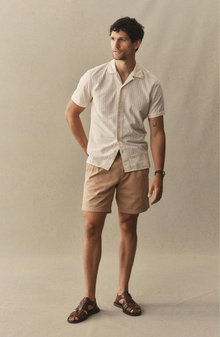 fit model posing in The Pleated Short in Organic Field Khaki Twill