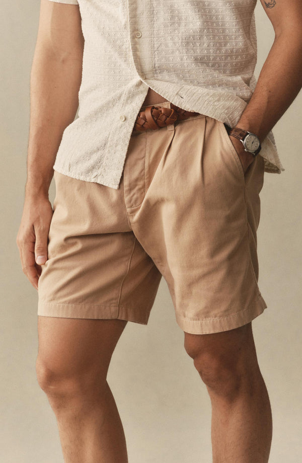 fit model showing off The Pleated Short in Organic Field Khaki Twill