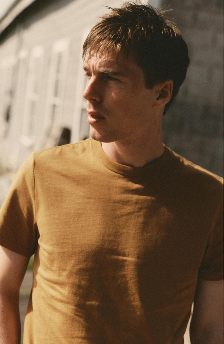 fit model posing in The Regenerative Cotton Tee in Saffron