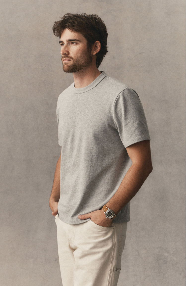 fit model posing in The Organic Cotton Shop Tee in Heather Grey