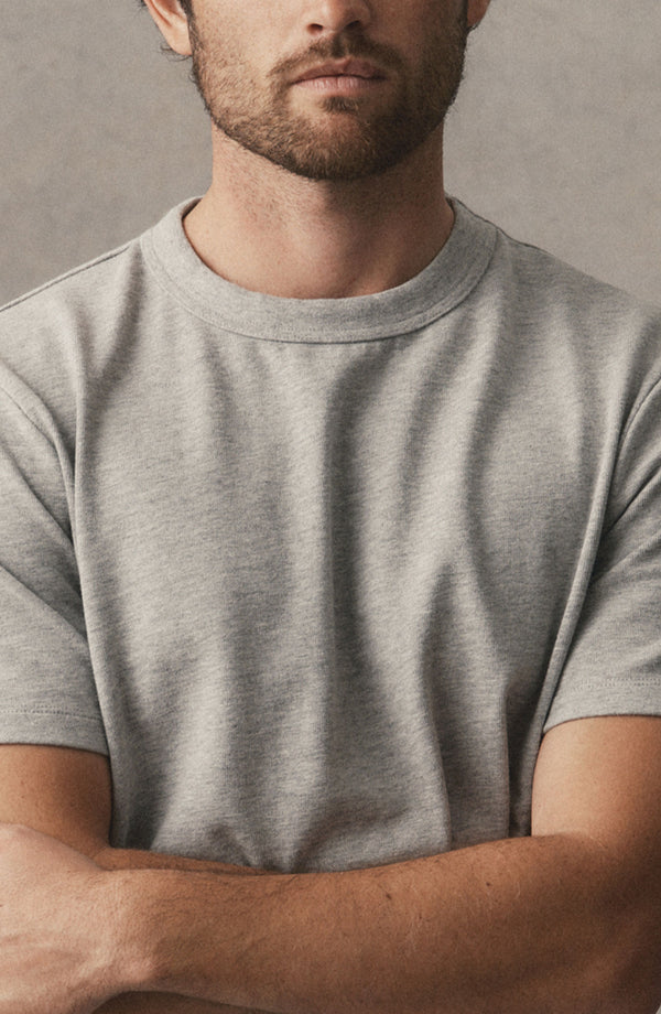 fit model showing off the collar on The Organic Cotton Shop Tee in Heather Grey