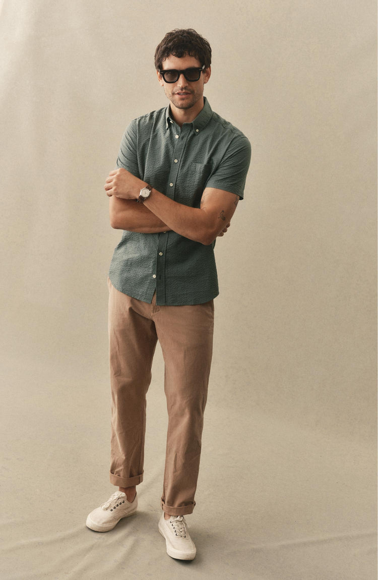fit model posing in The Short Sleeve Jack in Deep Sea Seersucker