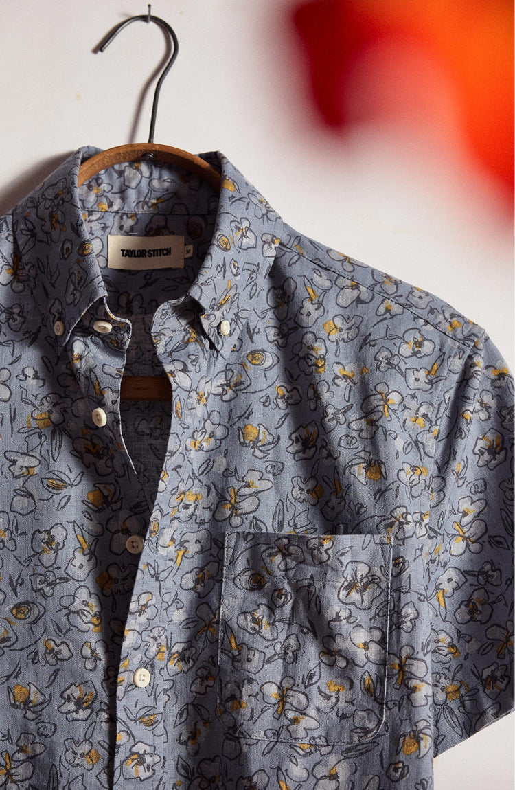 editorial image of The Short Sleeve Jack in Light Blue Floral on a hanger