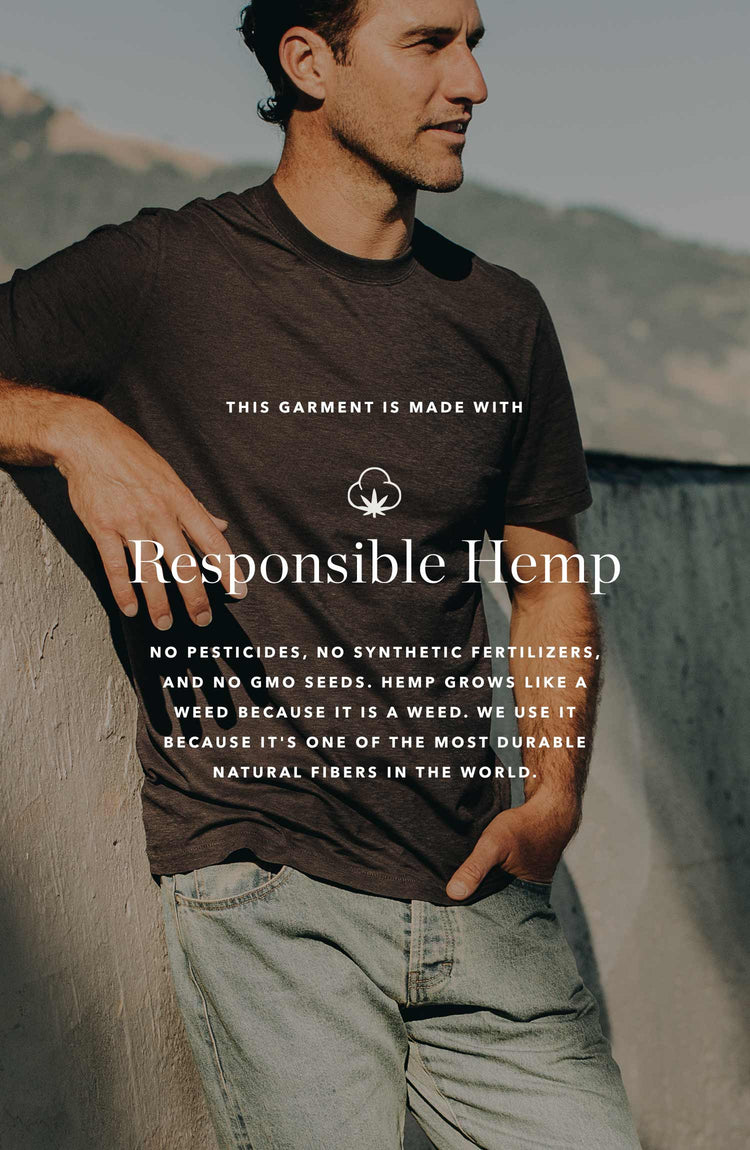 our cotton hemp tee in navy–worn with jeans
