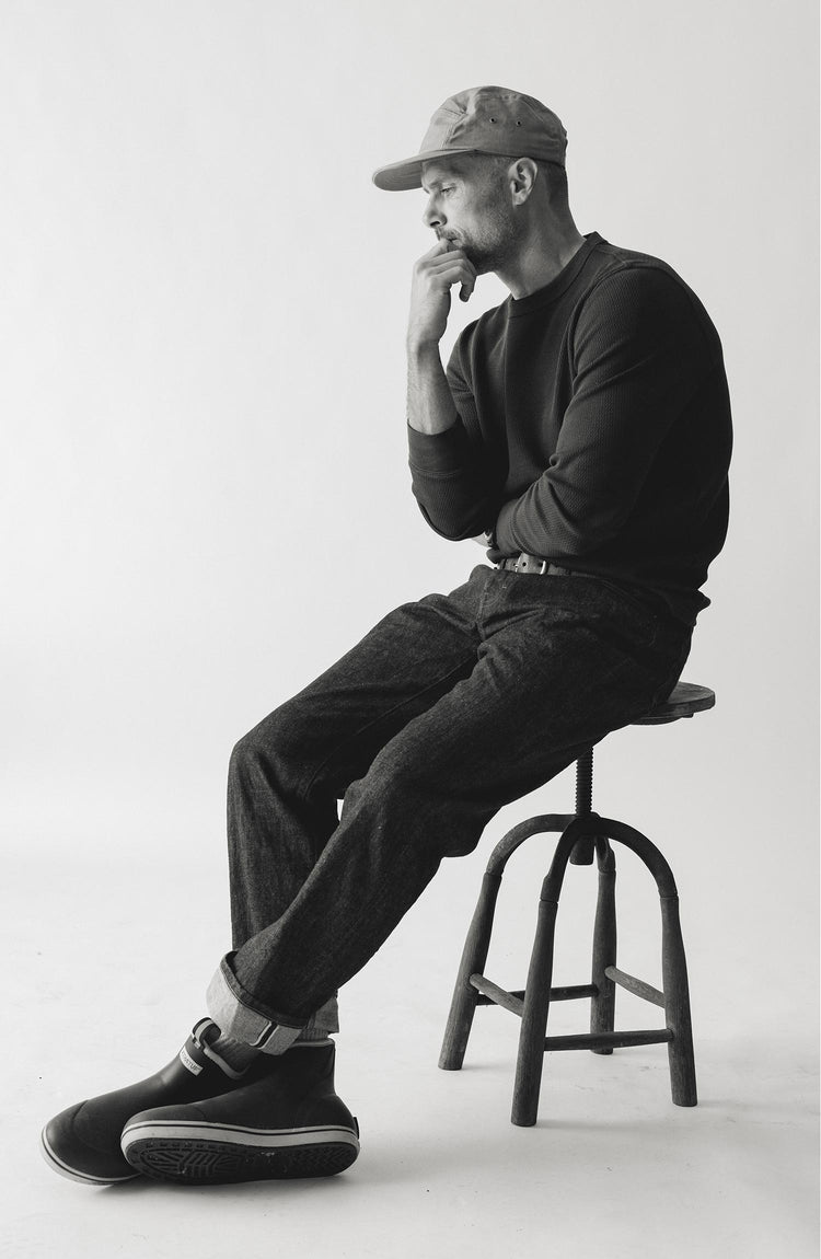 fit model sitting on The Straight Jean in Rigid Organic Selvedge