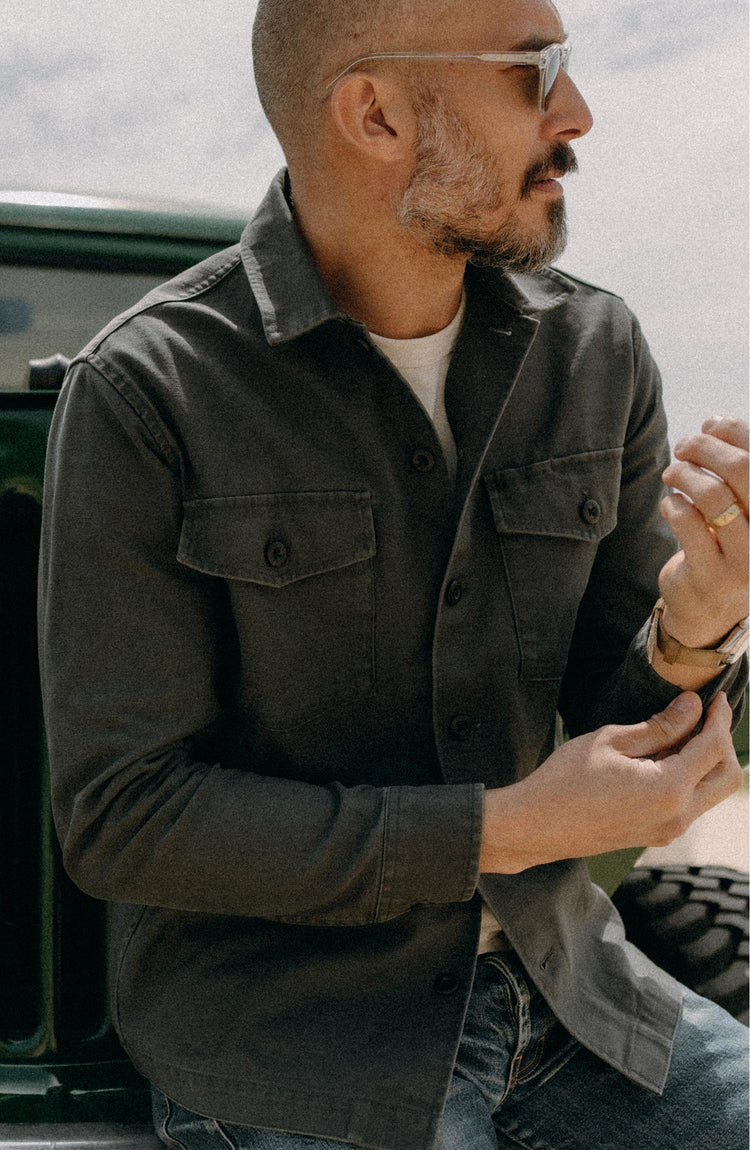 fit model posing n The Surplus Shirt in Faded Black Reverse Sateen