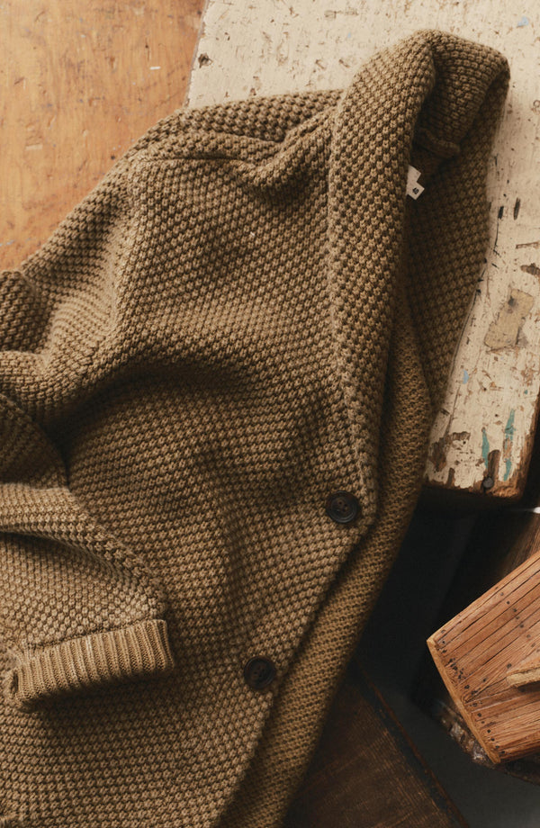 editorial flatlay of The Crawford Sweater in Bay Leaf