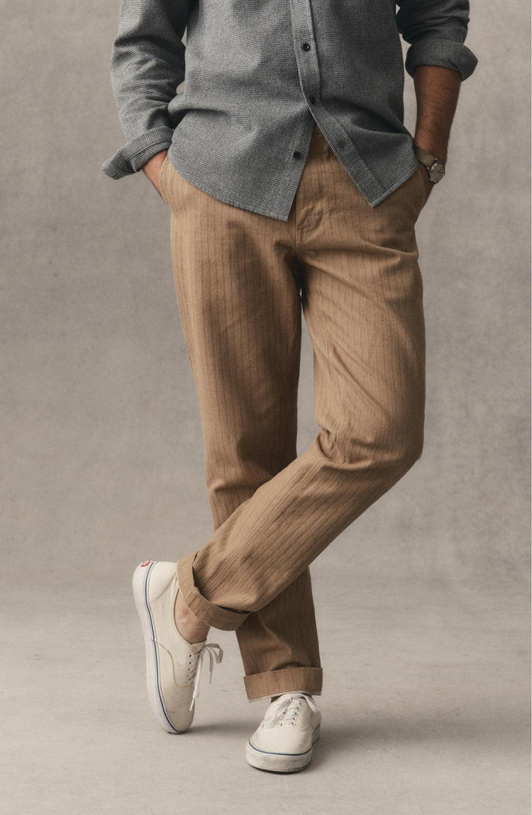 fit model posing in The Emlen Pant in Khaki Herringbone