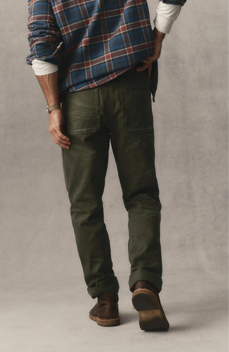 fit model posing in The Good Acre Chore Pant in Olive Canvas