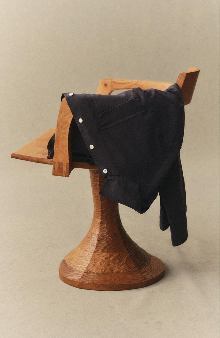 fit model posing in The Shore Shirt in Navy Tencel