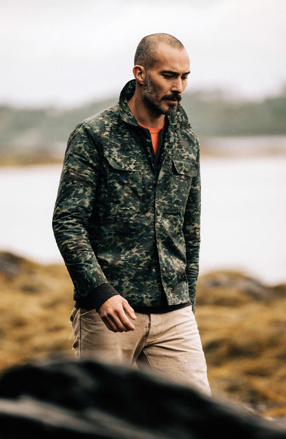 Our model wearing The Venture Jacket in Painted Camo Waxed Canvas
