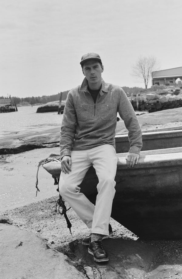fit model sitting wearing The Tiller Half Zip in Greyscale Hemp Jaspe