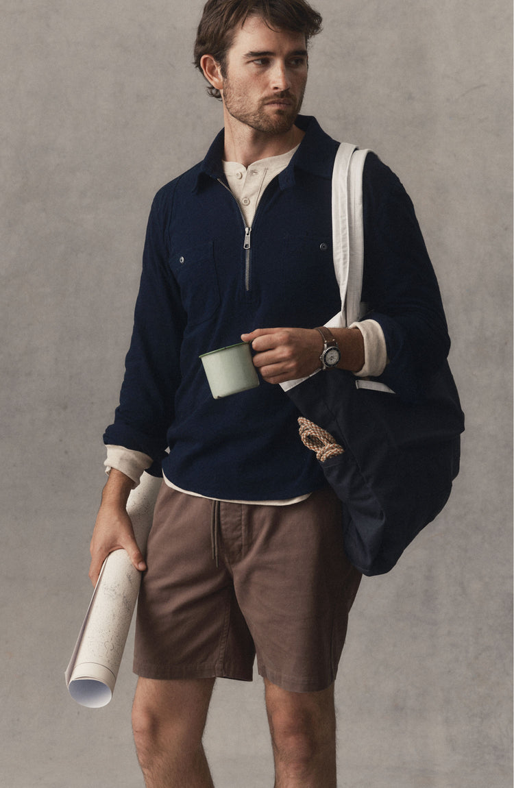 fit model posing in The Tiller Half Zip in Rinsed Indigo Slub