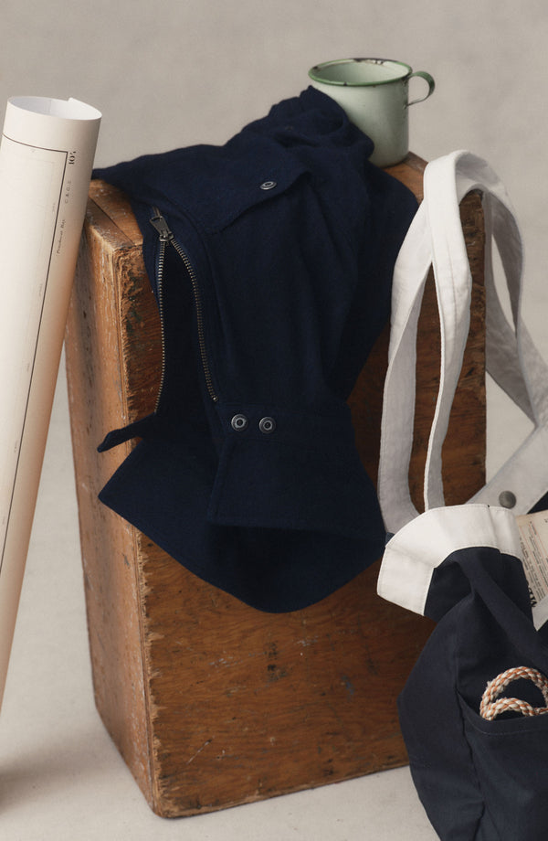 editorial image of The Tiller Half Zip in Rinsed Indigo Slub on a block