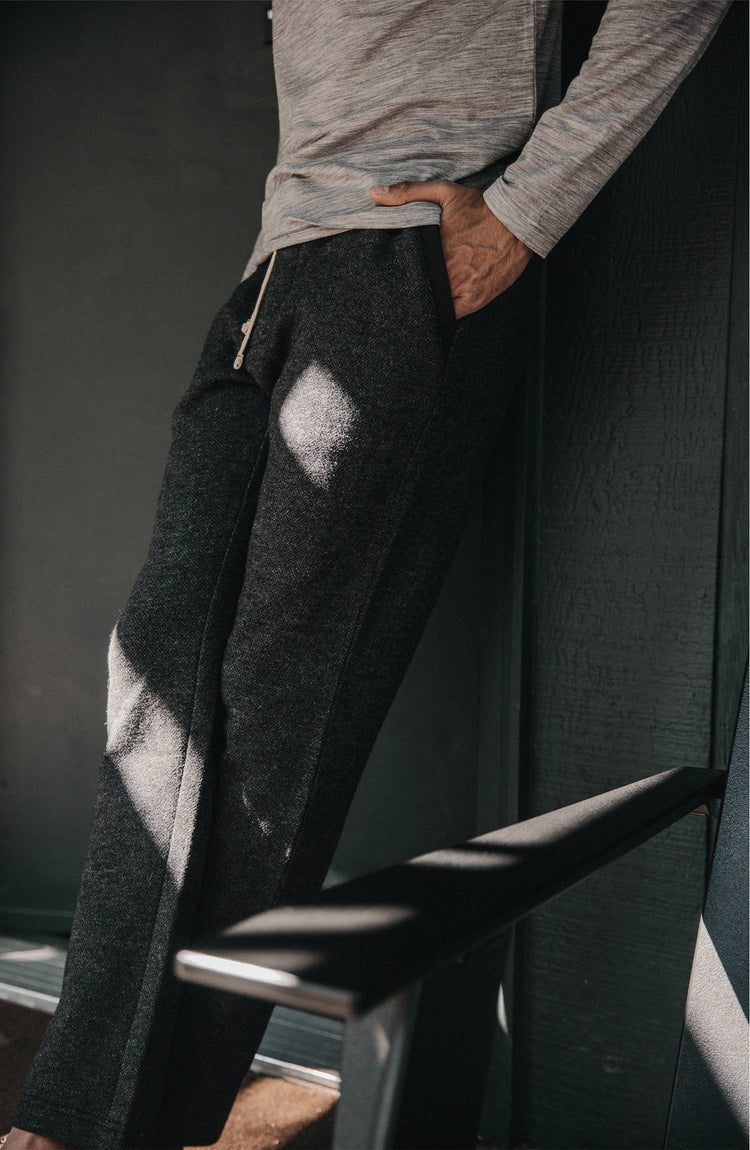 Model wearing The Weekend Pant in Charcoal Herringbone Wool with hand in pocket