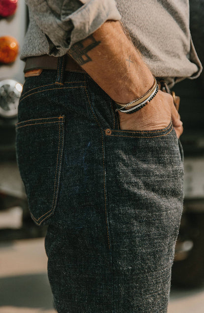 our fit model wearing the democratic jean, cropped shot with text on the right