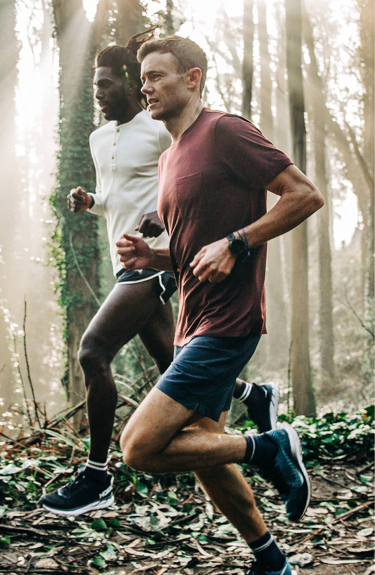 Our guy rocking The Tracksmith Collection traverse short, on trail