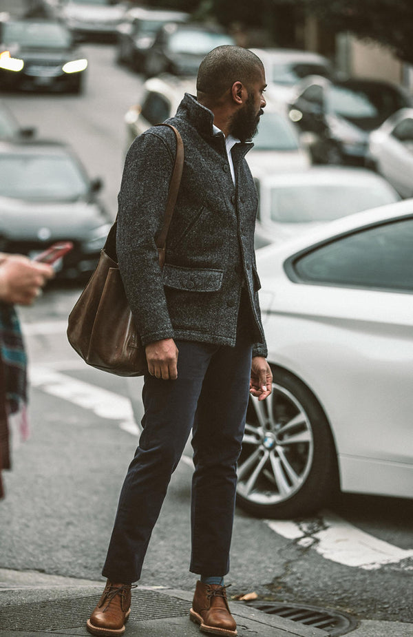Checking out passers-by, who surely checkin out this man in his full TS ensemble.