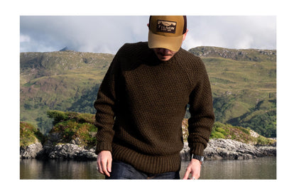Evan wearing the Fisherman Sweater in Loden in the Scottish Highlands