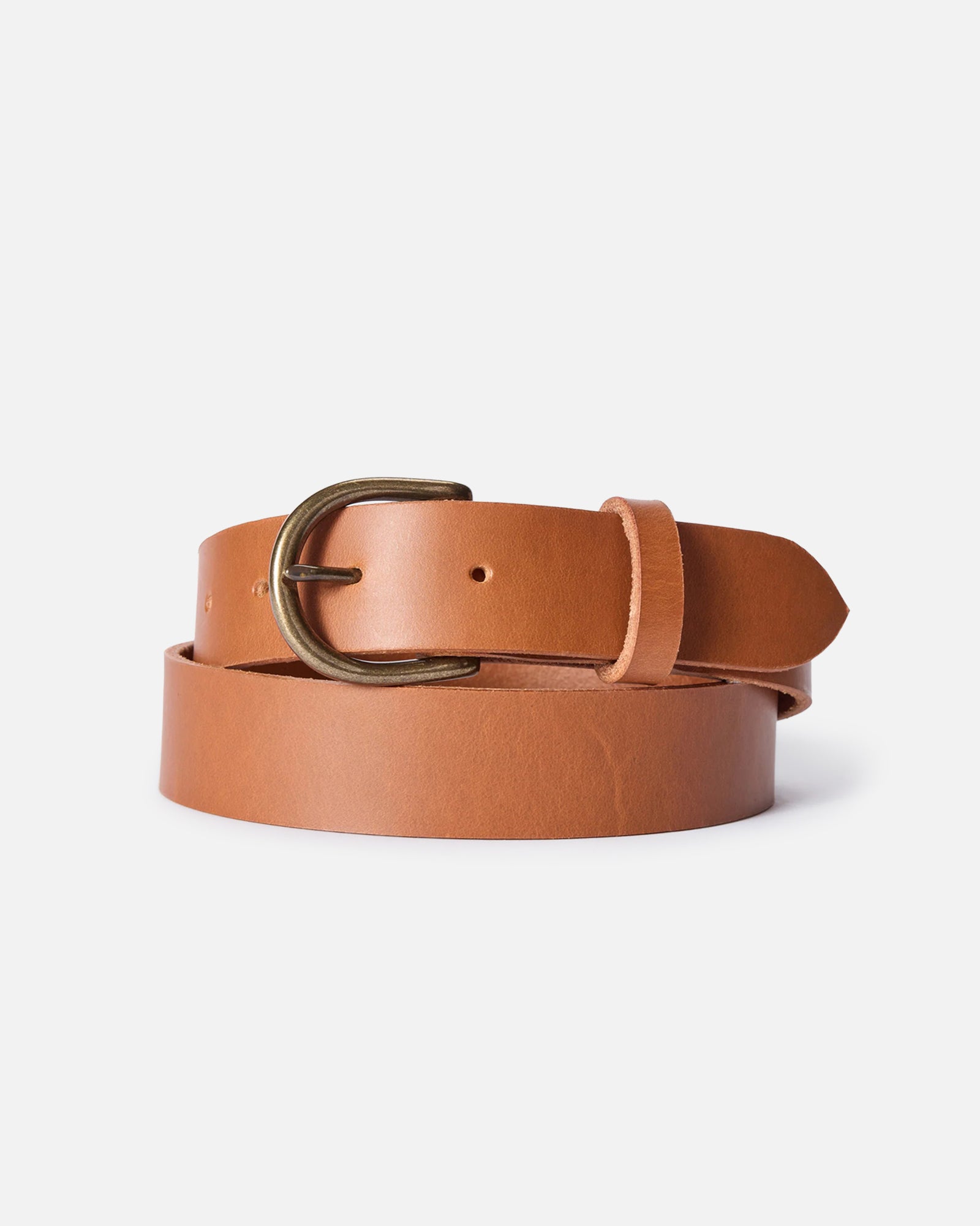 editorial image of The Foundation Belt in Whiskey rolled up, Accessories by Taylor Stitch