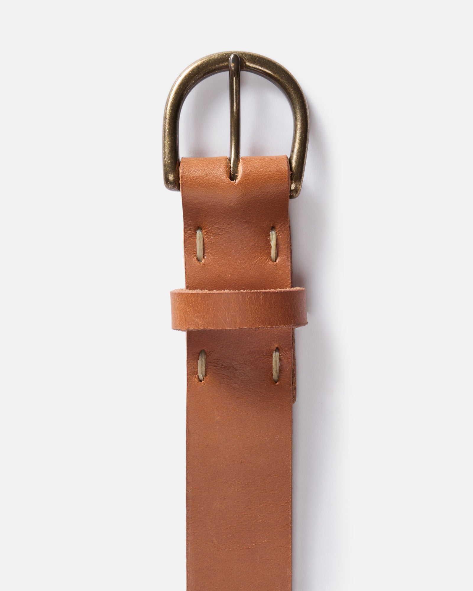 editorial flatlay of the buckle on The Foundation Belt in Whiskey, Accessories by Taylor Stitch