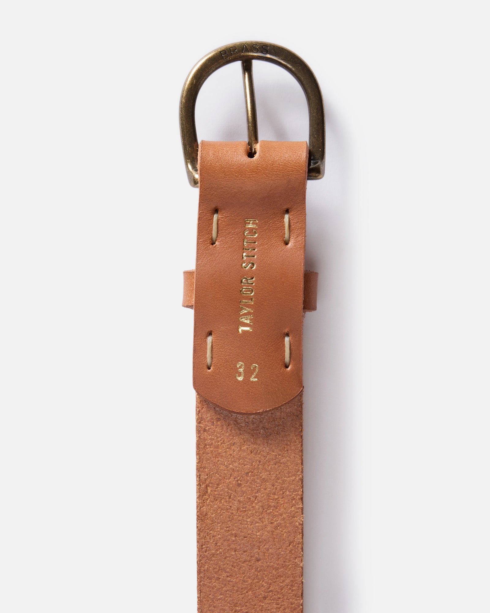 editorial flatlay of the back of the buckle on The Foundation Belt in Whiskey, Accessories by Taylor Stitch