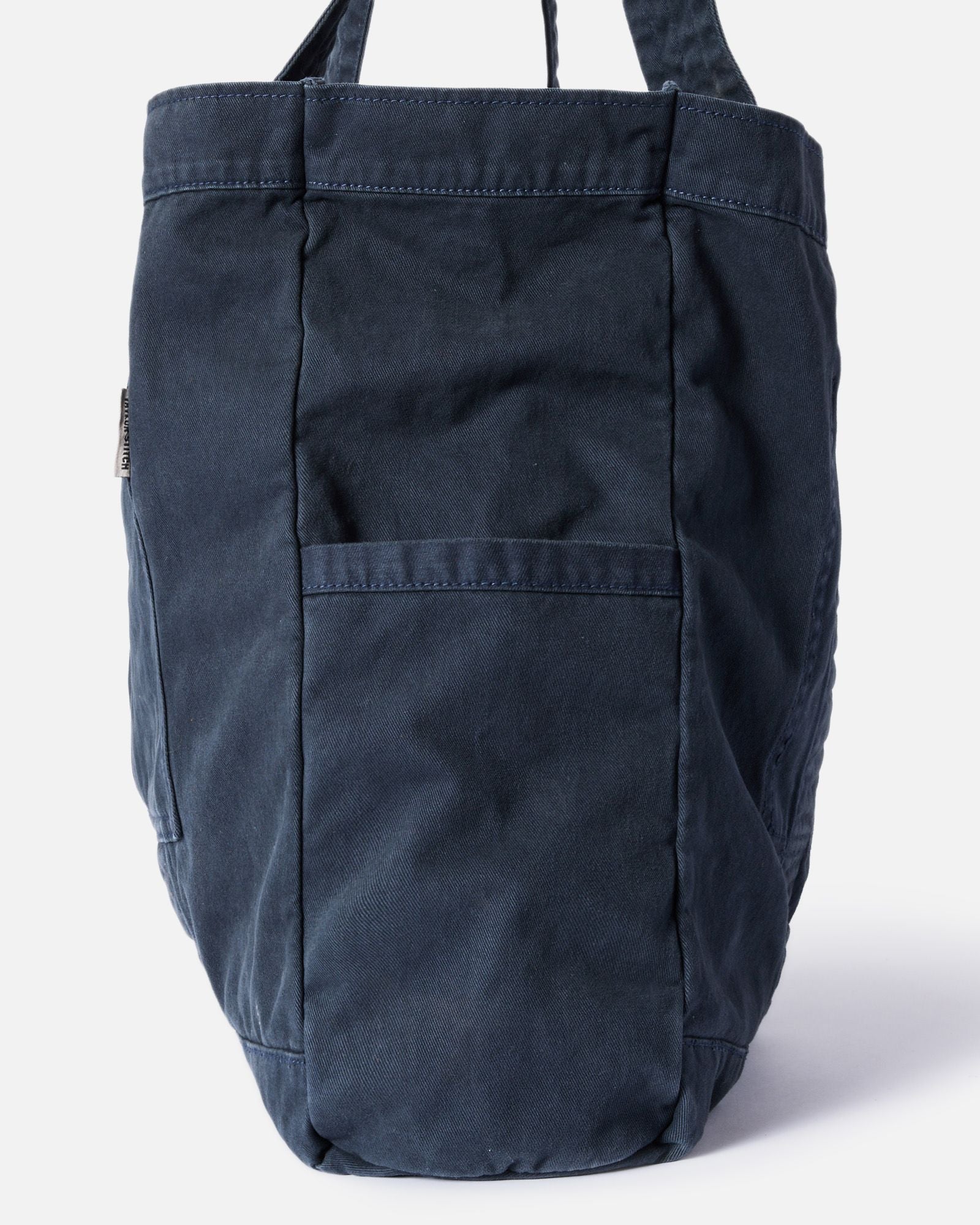 editorial image of the side pocket on The Foundation Tote in Organic Navy, Accessories by Taylor Stitch