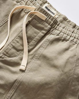 material shot of the waistband on The Apres Trail Short in Light Sage Slub, Bottoms by Taylor Stitch