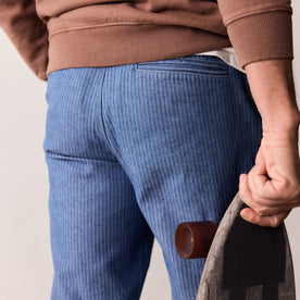 fit model showing the back of The Morse Pant in Bleached Indigo Herringbone