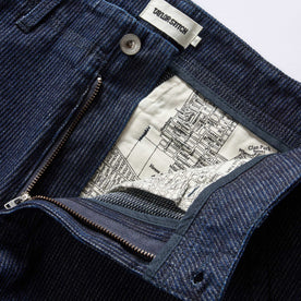 material shot of the zipper fly on The Morse Pant in Rinsed Indigo Stripe