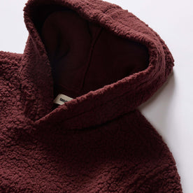 material shot of the hood on The Nomad Hoodie in Burgundy Sherpa