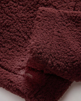 material shot of the hemmed sleeves on The Nomad Hoodie in Burgundy Sherpa, Outerwear by Taylor Stitch