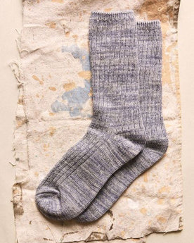 The Rib Sock in Ash Melange on a textured surface, Accessories by Taylor Stitch