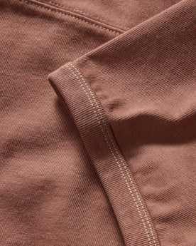 material shot of the ribbed sleeves on The Rugby Tee in Faded Brick, Knits by Taylor Stitch