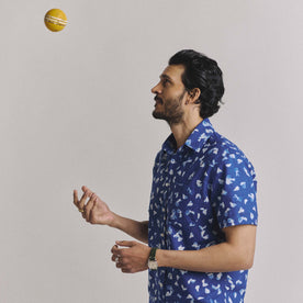 fit model throwing a ball wearing The Short Sleeve California in Dark Navy Ginkgo
