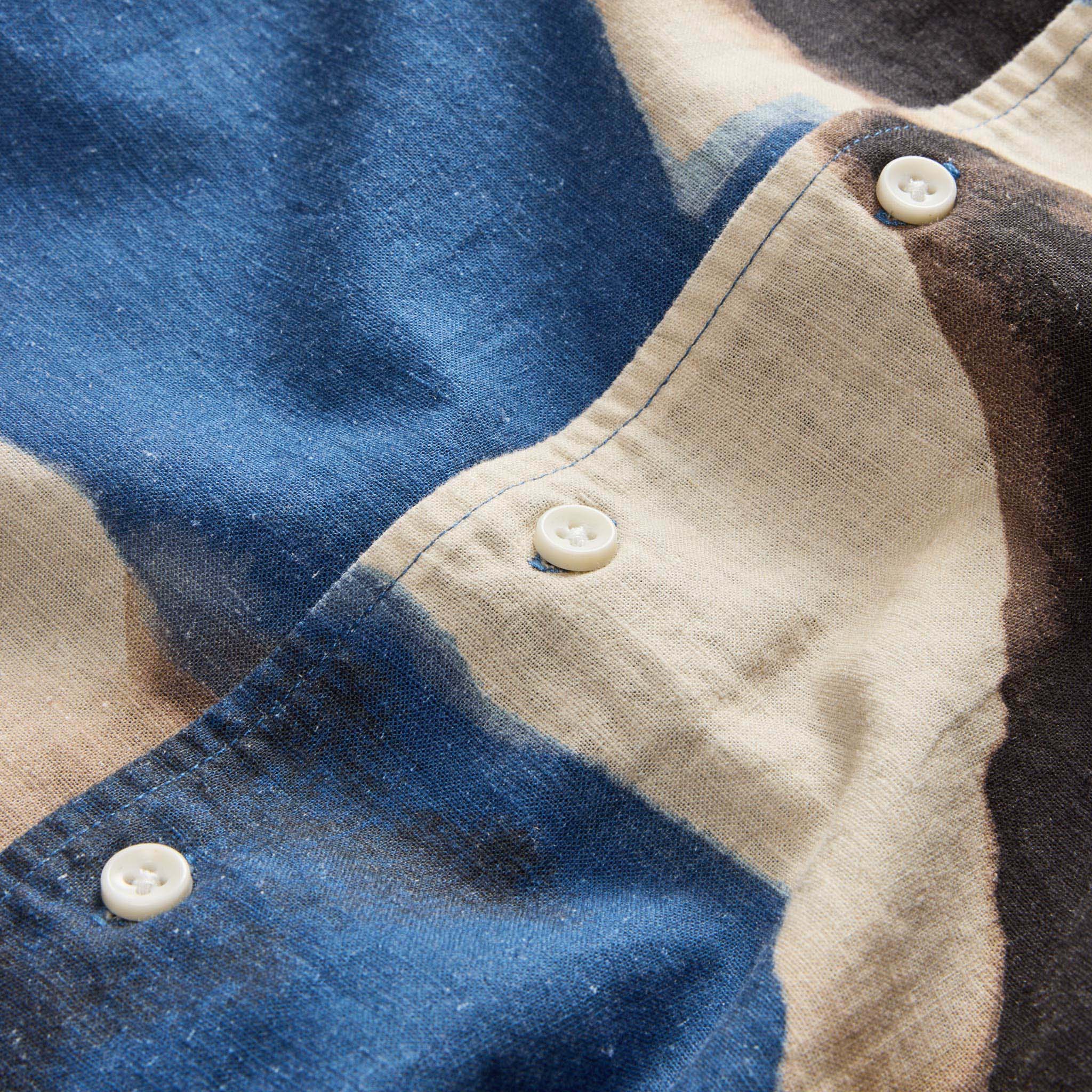 material shot of the buttons on The Short Sleeve Carter in Dark Navy Abstract, Wovens by Taylor Stitch