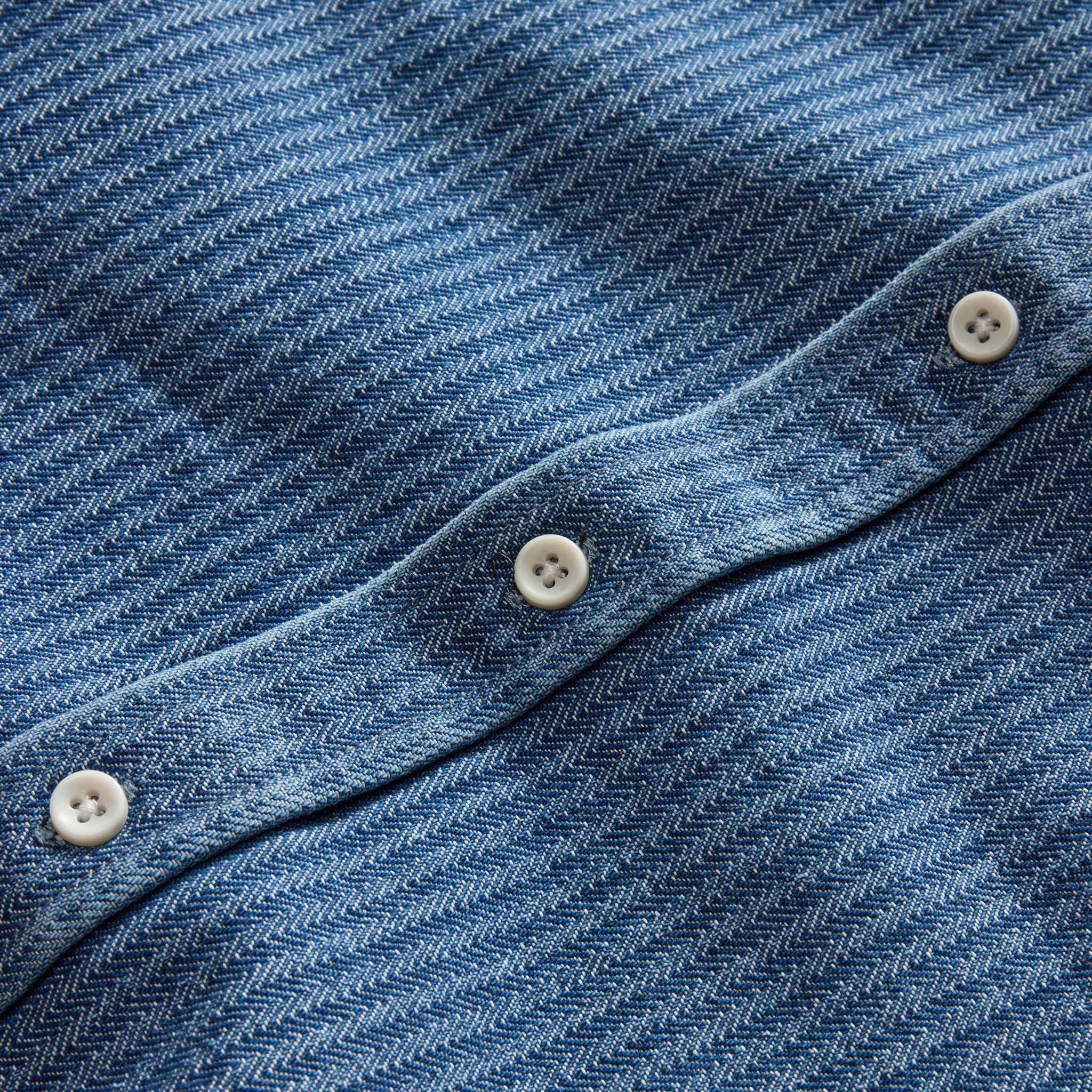 material shot of the buttons on The Utility Shirt in Washed Indigo Herringbone, Wovens by Taylor Stitch