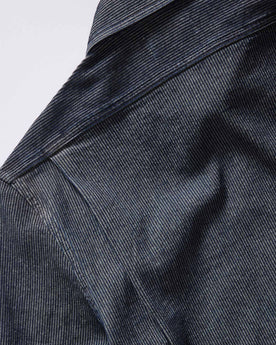 material shot of the shoulder on The Utility Shirt in Rinsed Indigo Stripe, Wovens by Taylor Stitch