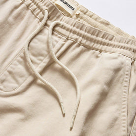material shot of the waistband on The Apres Short in Organic Aged Stone Foundation Twill