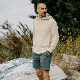 fit model walking wearing The Bryan Pullover Sweater in Flax Melange
