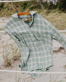 material shot of The California in Sea Moss Plaid on a hanger in the wind, Wovens by Taylor Stitch