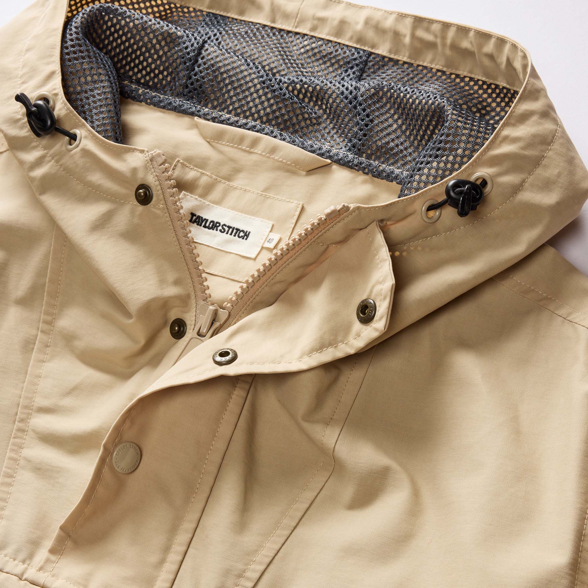 material shot of the hood and collar on The Chapman Anorak in Light Khaki, Outerwear by Taylor Stitch
