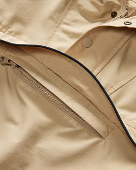 material shot of the hidden pocket on The Chapman Anorak in Light Khaki, Outerwear by Taylor Stitch