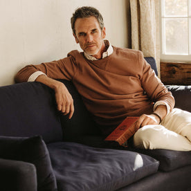 fit model on a couch in The Cotton Hemp Crew in Faded Brick