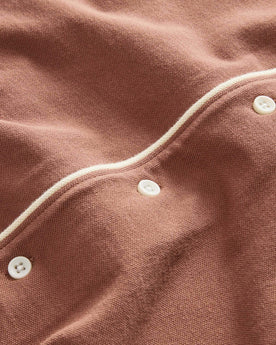 material shot of the buttons on The Harwich Shirt in Faded Brick Tipped Pique, Knits by Taylor Stitch