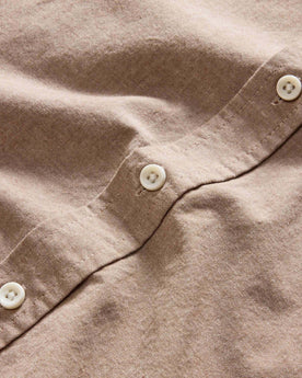 material shot of the natural-colored buttons on The Jack in Faded Brick Chambray, Wovens by Taylor Stitch