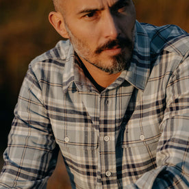 fit model showing the front chest pockets on The Ledge Shirt in Faded Blue Plaid